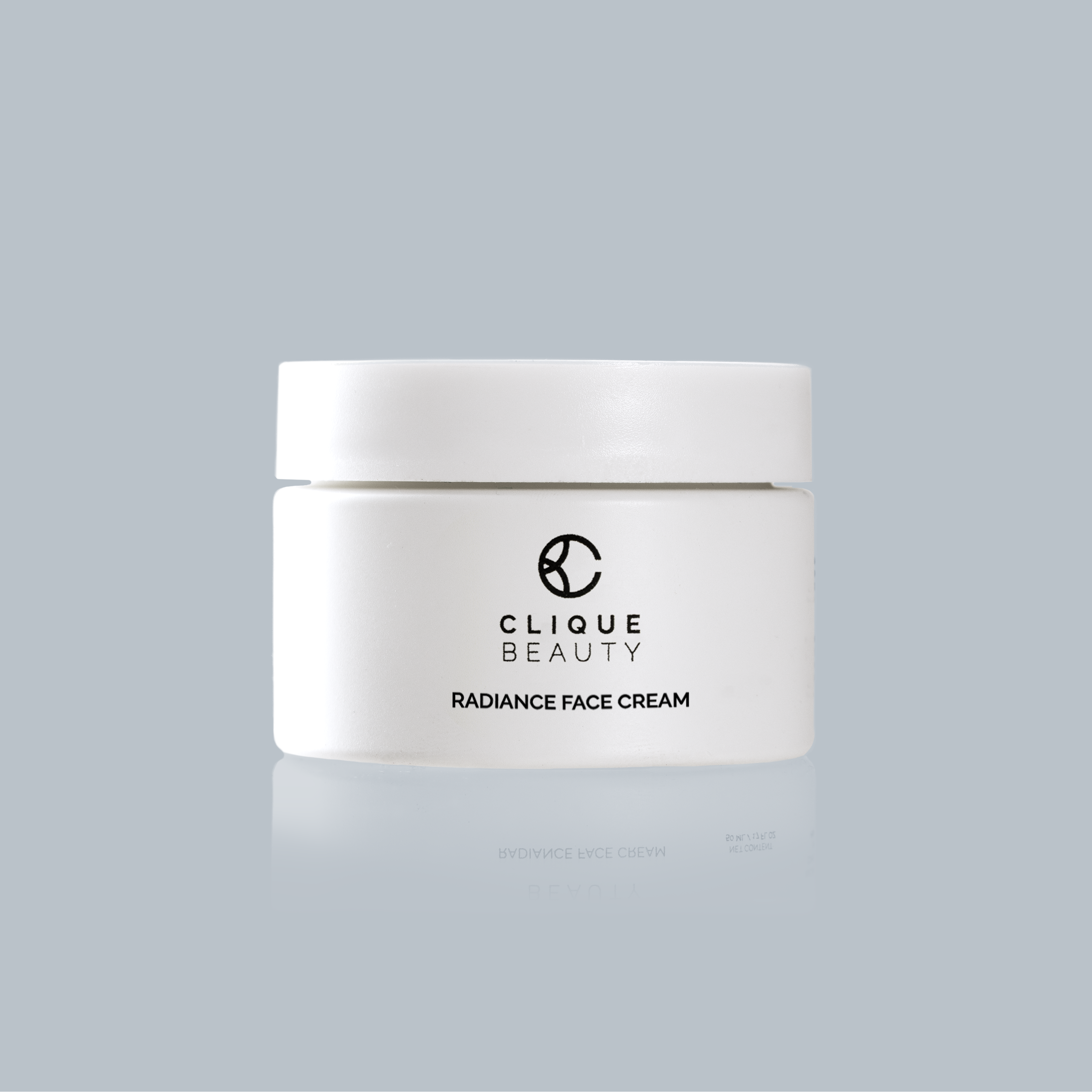 White jar of Clique Beauty Radiance Face Cream on a light gray background