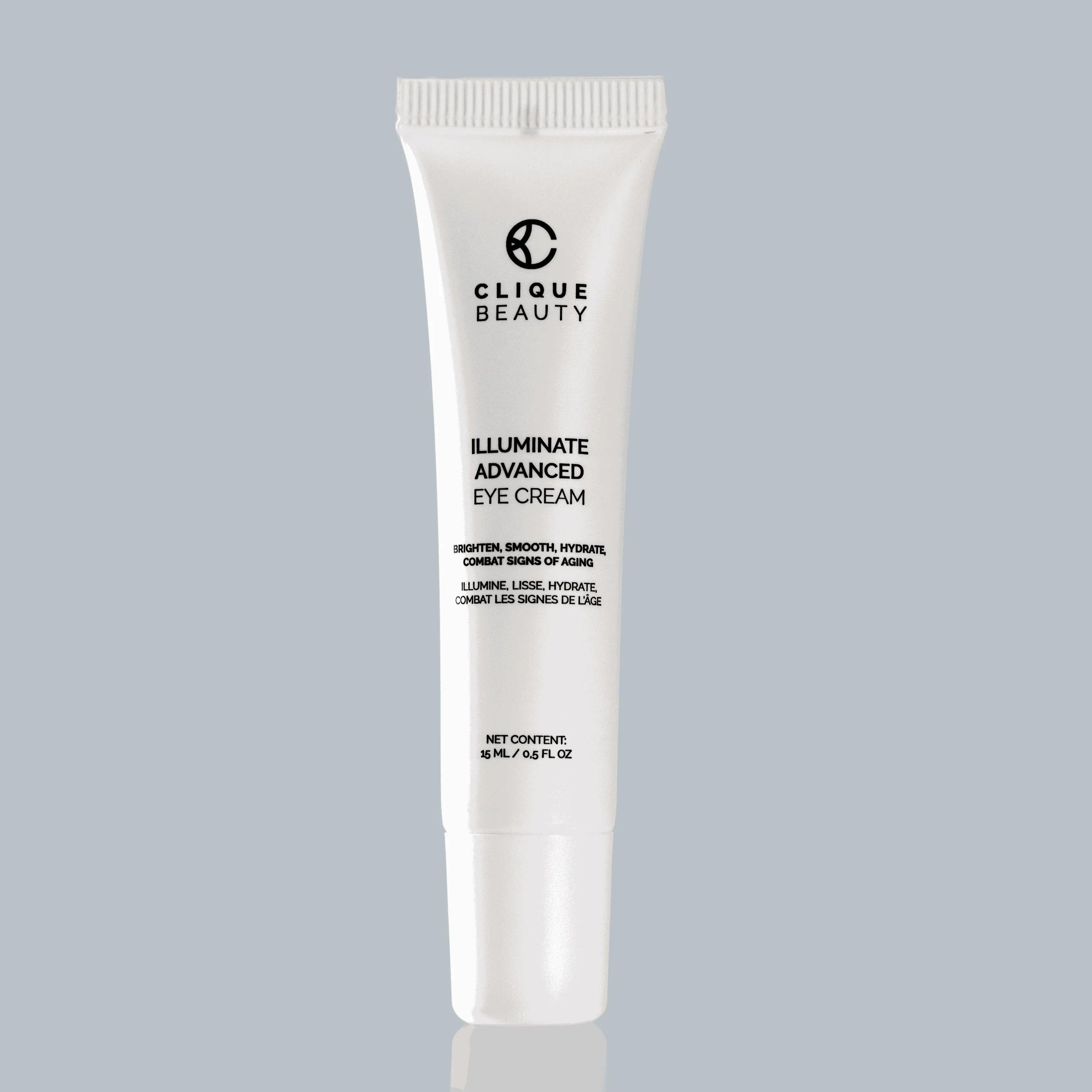 Tube of Clique Beauty Illuminate Advanced Eye Cream on a gray background