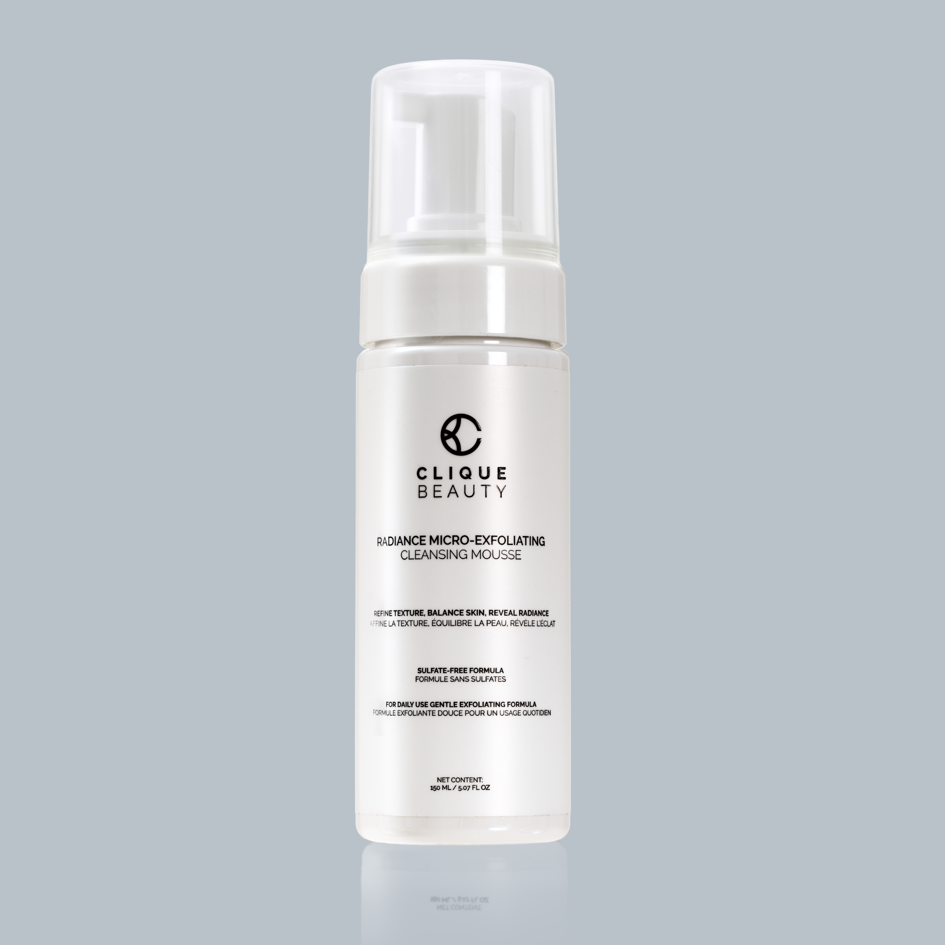 Clique Beauty cleansing mousse bottle on a gray background